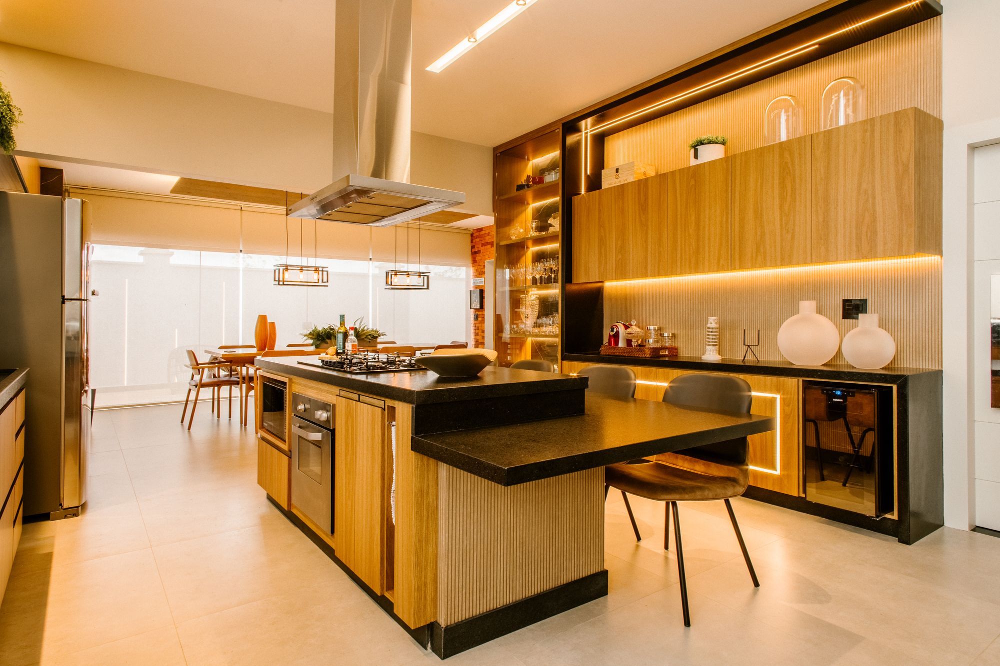 Renovated kitchen with a central island and timber cabinetry